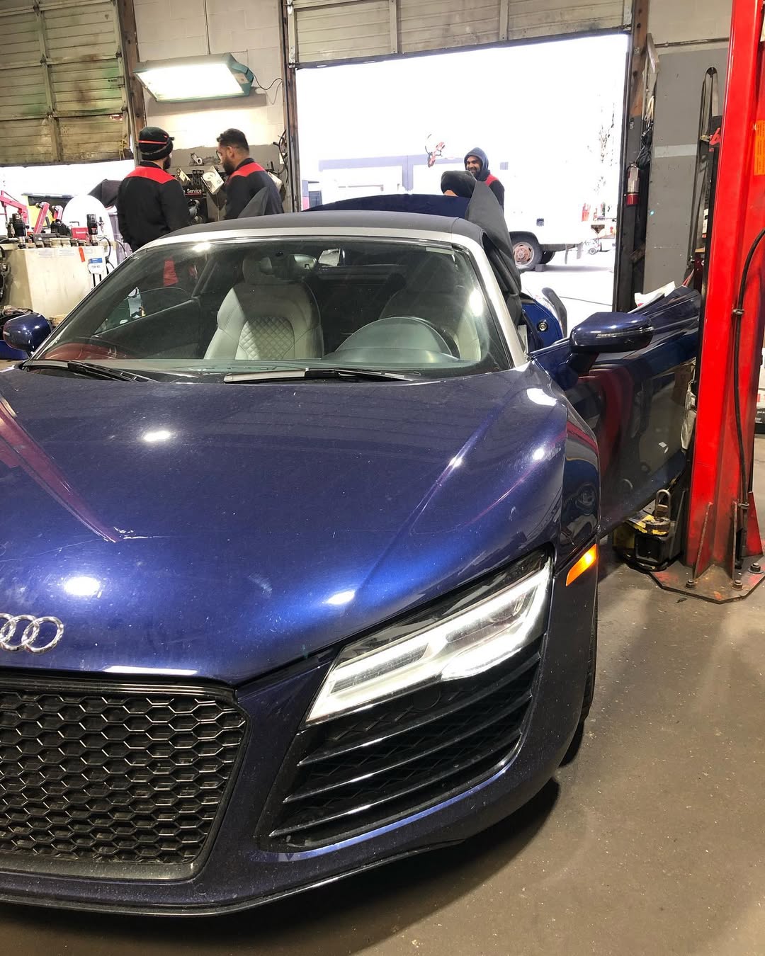 Blue Audi R8 in the Gill Motors workshop for an oil change